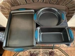 3 Rachael Ray Non-stick Baking Pans With Rubber Grips. Fixed Price $39.00.